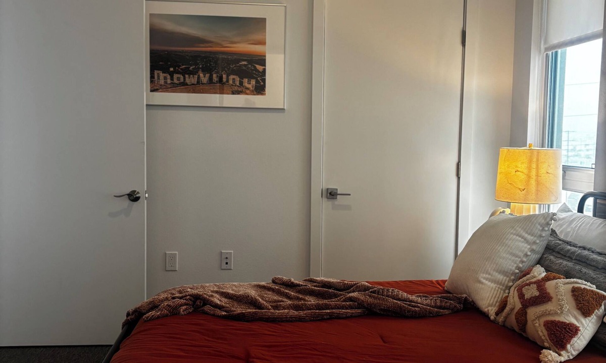 Carlson Park Apartment | A bike ride to the beach furnished bedroom with en-suite bathroom!