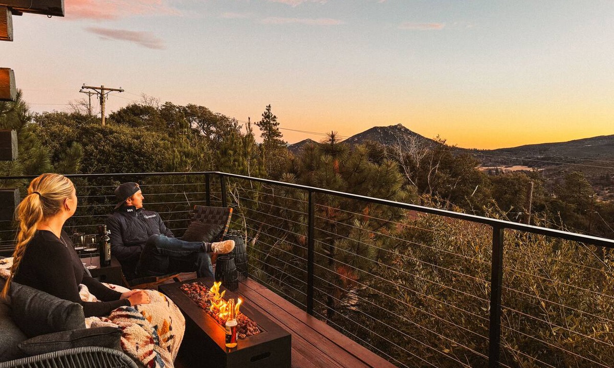 Julian Cabin | Award-winning A-frame in Julian. Luxe interiors, gorgeous sunset views on a wrap around deck with firepit, cedar hot tub, and total mountain serenity.