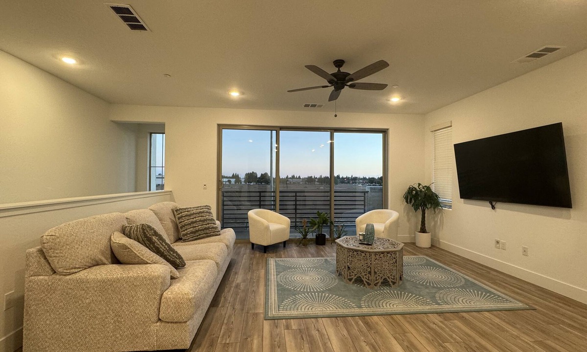 Clovis House | Charming 2-bedroom townhome with garage, pool access, & all utilities included.