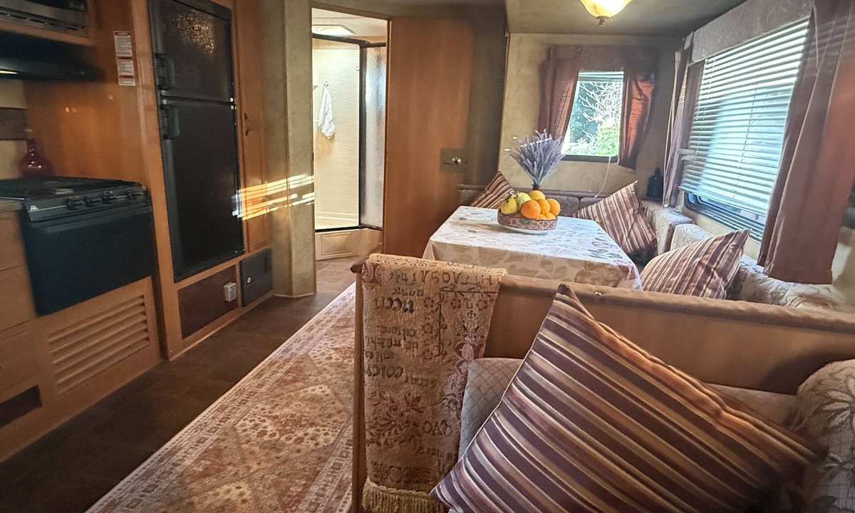 Ojai House | Ojai Pixie Suite spacious contemporary trailer, outdoor living area, rose garden
