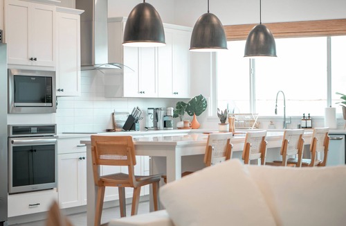 Friant House | 4 Bed 3 Ba Home near Lake with Chef’s Kitchen, Private Gym, & Attached Suite.