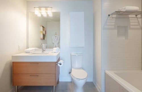 Downtown Los Angeles Apartment | Enjoy city views with one king bed and one queen bed and two bathrooms.