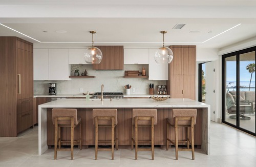 Corona del Mar Condo | Experience a luxurious 4-bedroom, 4.5-bath mid-century modern coastal escape in Corona Del Mar, CA. Steps from the Pacific Ocean, this fully remodeled home features a gourmet kitchen, private hot tub, sauna, and Cntrl4 system. Comfortably fits 10