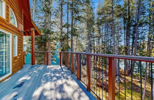Serene Lakes House | Family-friendly lakefront getaway with a gas fireplace furnished deck & views