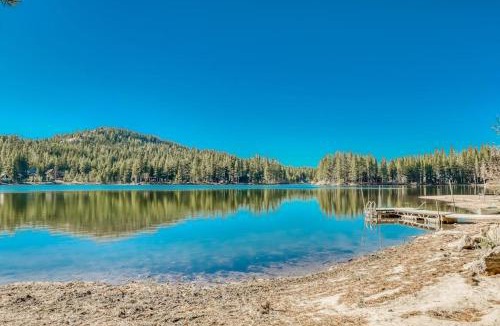 Serene Lakes House | Family-friendly lakefront getaway with a gas fireplace furnished deck & views
