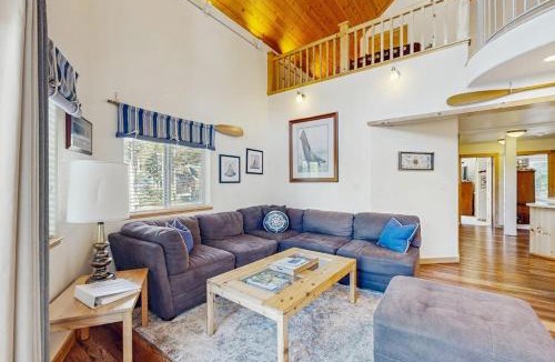 Serene Lakes House | Family-friendly lakefront getaway with a gas fireplace furnished deck & views
