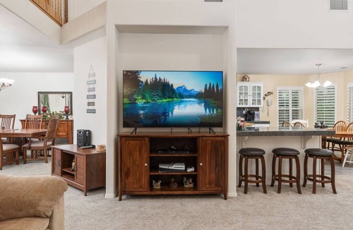 Shaver Lake House | Family-friendly mountain retreat with two game rooms, a screened-in patio with firepit, garage game zone, hot tub, sauna, yoga mats, and beautiful Sierra views.
