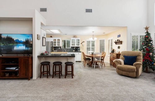 Shaver Lake House | Family-friendly mountain retreat with two game rooms, a screened-in patio with firepit, garage game zone, hot tub, sauna, yoga mats, and beautiful Sierra views.