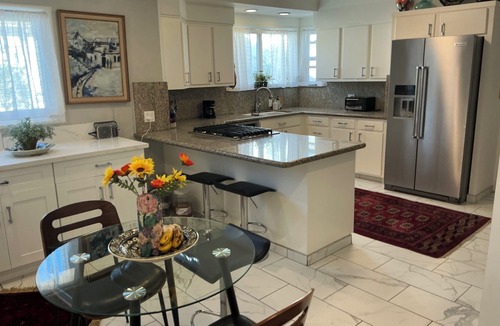 Mid City House | Garden with two hundred fruit trees and swimming pool