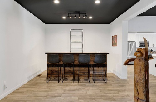 The Village Ski Chalet | Hillside Hideaway ~ Dog-friendly home with wraparound deck, grill, game room, & bar - walk to dining