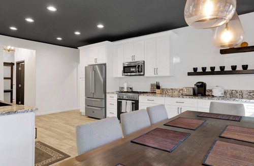 The Village Ski Chalet | Hillside Hideaway ~ Dog-friendly home with wraparound deck, grill, game room, & bar - walk to dining