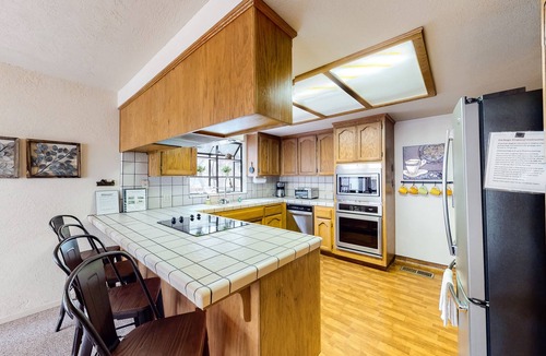 Groveland House | Home with private hot tub & fireplace - walk to beach, two dogs OK