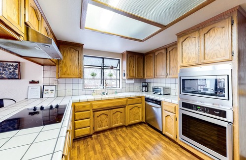 Groveland House | Home with private hot tub & fireplace - walk to beach, two dogs OK
