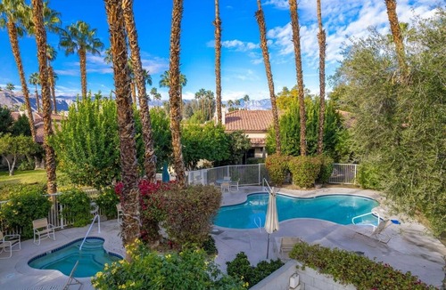 Palm Desert Condo | Lake view, steps to the pool, resort in Palm Desert.