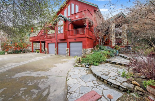 Three Rivers Ski Chalet | Majestic Riverfront Chalet is set down a serene and private drive.