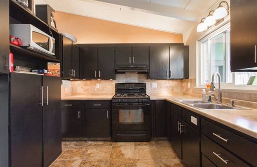 Mescal Corridor NW House | Monterey craftsman style home with vaulted exposed-beams ceiling hardwood floor