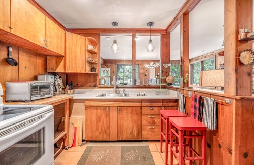 Hacienda House | Riverfront, dog-friendly home with private hot tub, fireplaces & amazing decks