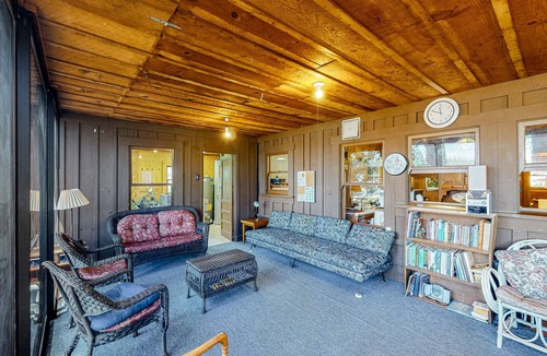 Bass Lake Cabin | Rustic, lakefront cabin with private dock, beach, screened porch & great view