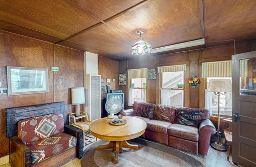 Bass Lake Cabin | Rustic, lakefront cabin with private dock, beach, screened porch & great view