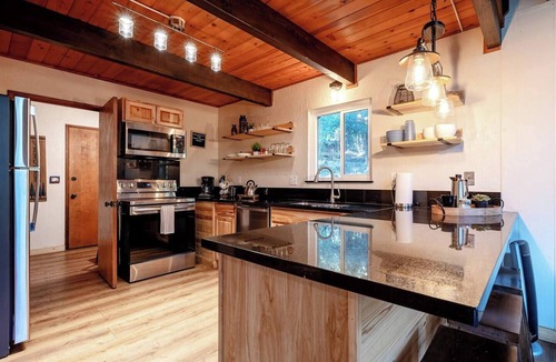 Camp Nelson Cabin | Trout River Cabin Secluded Family Forest Retreat