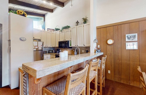 Mammoth Lakes Condo | Two-story condo w/mountain views, balcony, gas grill, & wood-burning fireplace
