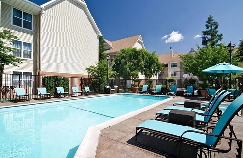 Raisin Hotel | Your Perfect Getaway in Fresno! Full Kitchen, Outdoor Pool, Pets Allowed!