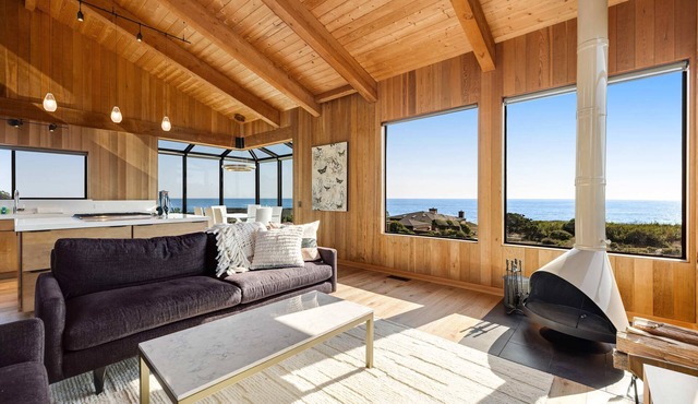 Luxe retreat with ocean views, hot tub, & gourmet kitchen - steps from beach