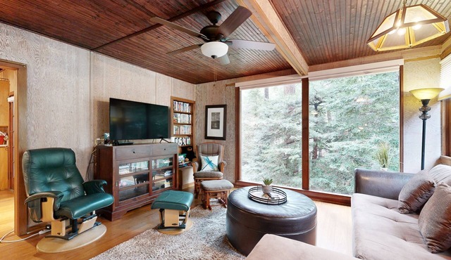 Rustic chic retreat set back among the trees with furnished deck