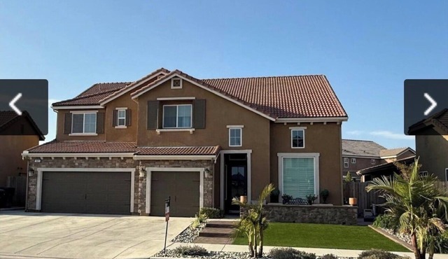 Spacious 4-bedroom house in peaceful Visalia with AC, pool, spa, full game room