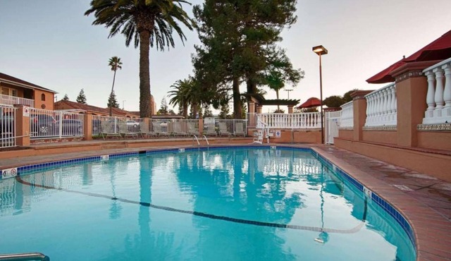 Stay Near Airport | Free Breakfast + Pool