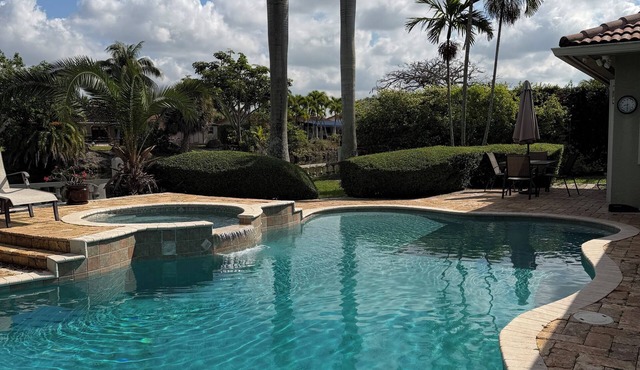 Waterfront Property with a resort style backyard and Heated Pool in Miami in Miami