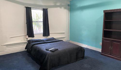Queen Room with Shared Bathroom