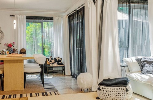 Lake Forest Condo | A Spacious room with artistic design and a bidet in the forest.