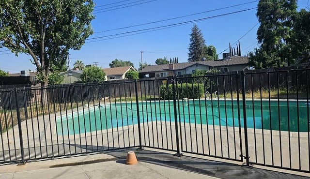 Charming 4 bedroom house with AC and WiFi in quaint Visalia with a gated pool